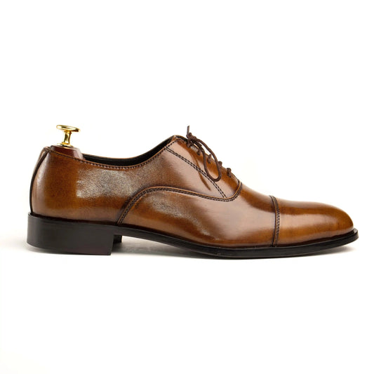 Side angle of OXFORD CAROB formal leather shoes for men, highlighting premium craftsmanship and timeless detailing.
