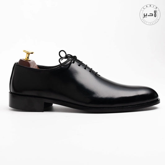 Side angle of OXY BLACK dress shoes, highlighting premium leather craftsmanship and durable stitching, perfect for modern men.